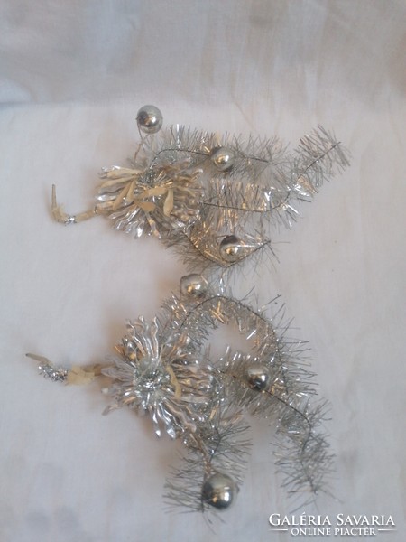 2 silver-colored wire Christmas tree ornaments