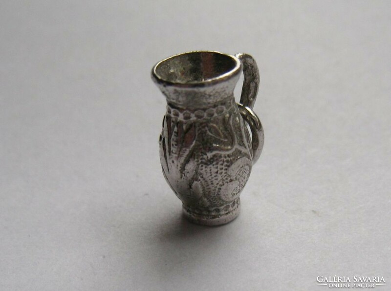 Folk potter's mug, jug, silver pendant