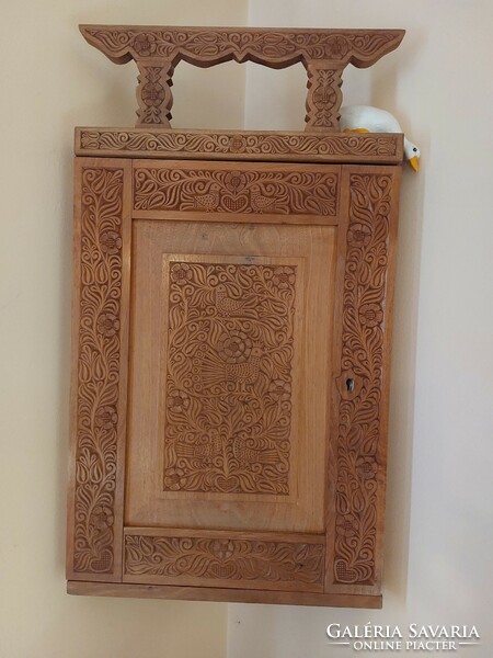 Beautiful carved wooden corner wall cabinet