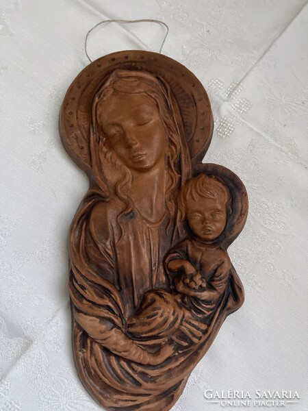 Ceramic image of Mary with baby Jesus.
