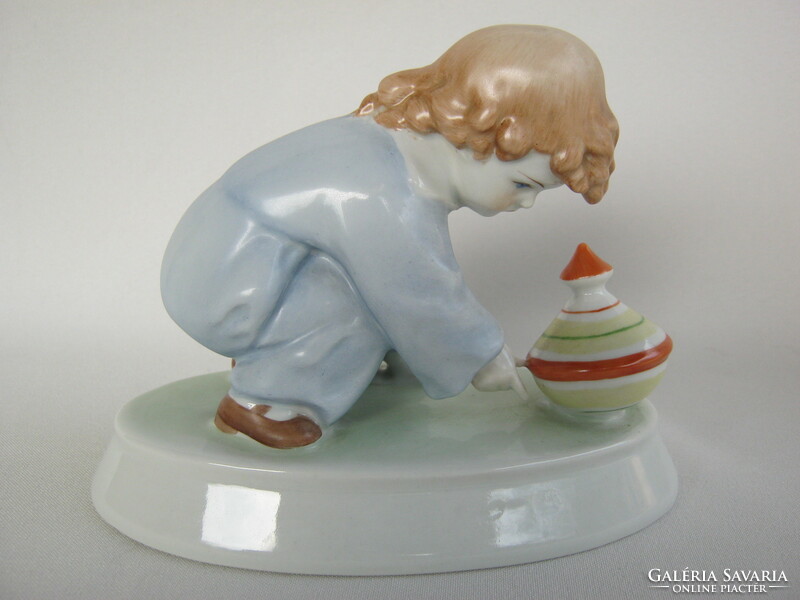 Zsolnay is a little boy playing with a porcelain whistle