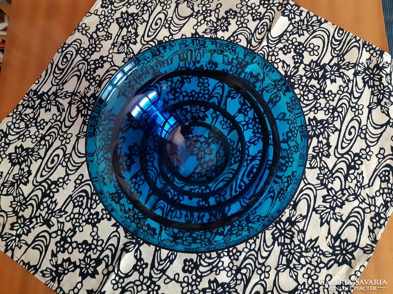 Turquoise glass bowl, offering, on a spiral iron base.