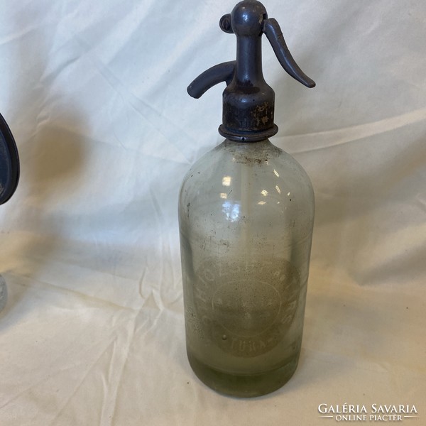 Antique soda bottle with tura inscription