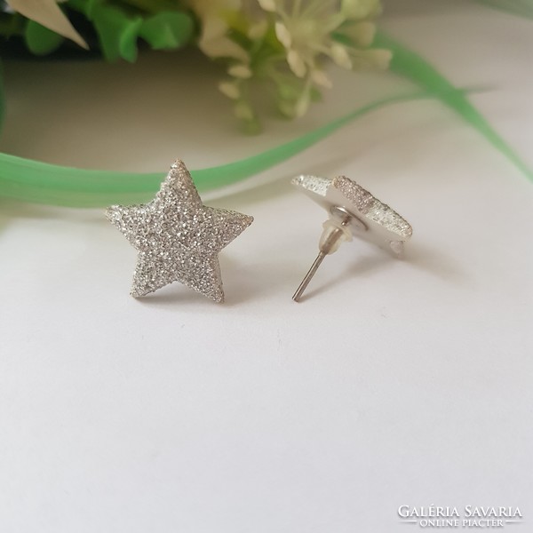 New, shiny silver-colored, star-shaped earrings, bijou