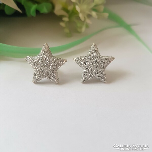 New, shiny silver-colored, star-shaped earrings, bijou