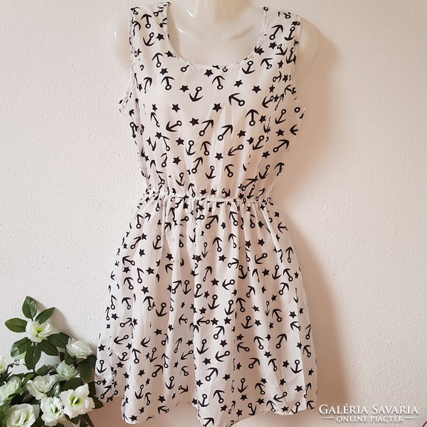New M sleeveless summer dress, mini dress with a star and anchor pattern on a white background