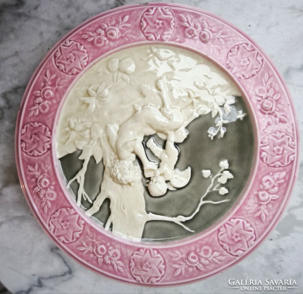 Antique wall plate schütz cilli majolica figural angel and faun .2. A pair is also for sale!