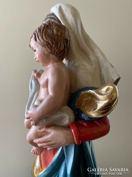 Beautiful wooden carved statue of Virgin Mary with child