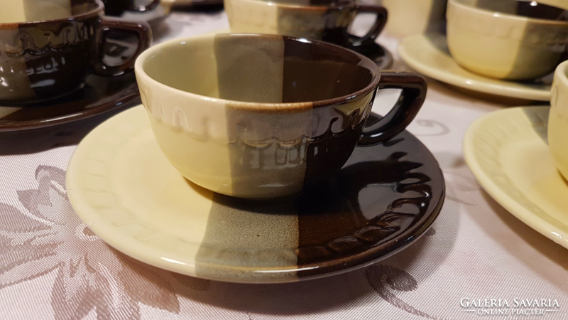 12 coffee cups, 12 coasters with small plates, 2 sugar holders