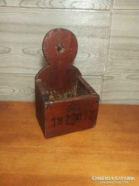 107-year-old folk carved coat of arms match holder