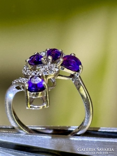 A beautiful silver ring, embellished with deep purple amethyst stones