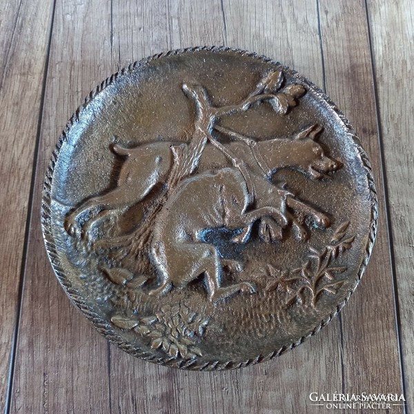Old bronze bowl with hunting dogs