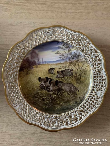 A large Herend plate with a painting by József Csiszár