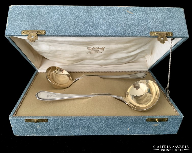 Pair of gold-plated silver ladles, in a box