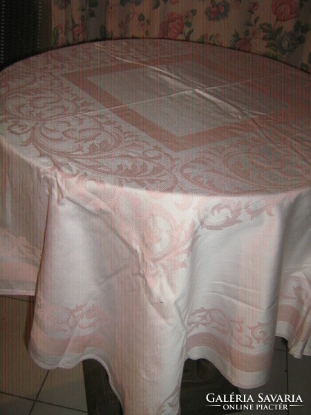 Beautiful pink vintage baroque patterned damask tablecloth with slippery decoration