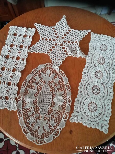 4 rows of crocheted small tablecloths