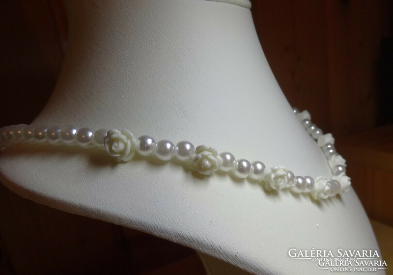 Necklaces made of white rose pearls and white shell pearls.
