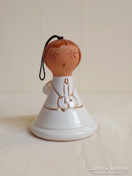 Glazed ceramic clay figurine, white angel statue holding a candle, ringing bell Christmas decoration