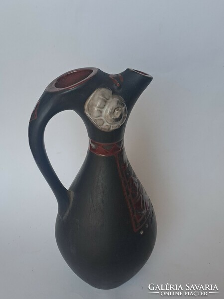 Ceramic jug with ram's head, spout