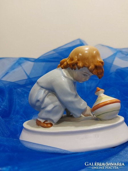 Zsolnay porcelán figura,búgócsiával játszó kisfiú