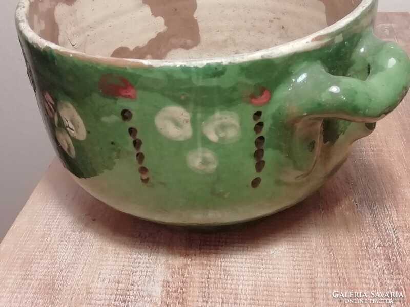 Old ceramic bowl with ears