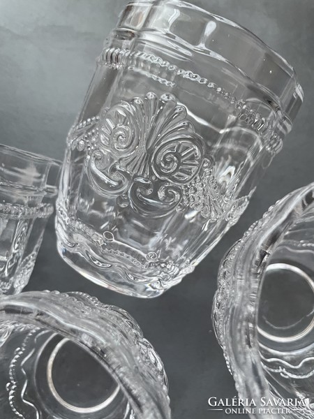 Vintage beautiful transparent patterned water glass with lily pattern, made of thick glass
