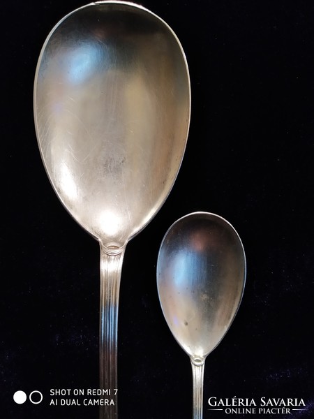 Pair of silver (800) art nouveau pudding spoons.