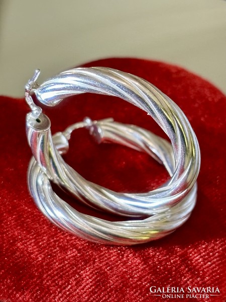 A pair of fabulous, shining silver hoop earrings
