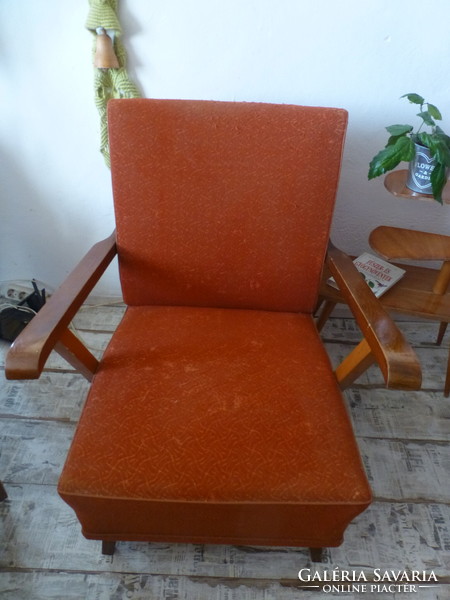 Scandinavian-style red retro armchair with bent arms