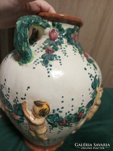 Old jug decorated with putts