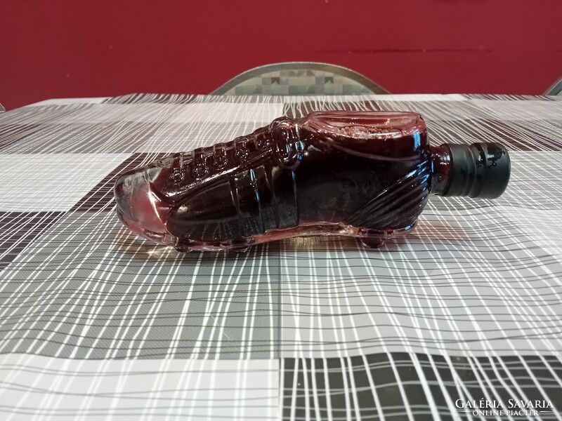 Wine bottle in the shape of a football boot