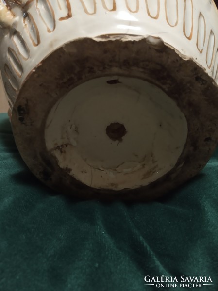 Old jug decorated with putts