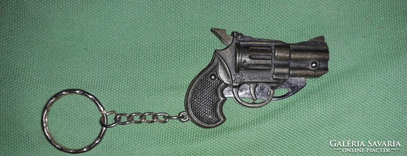 Old copper-colored pistol-shaped keyring knife with steel blade, in very nice condition according to the pictures