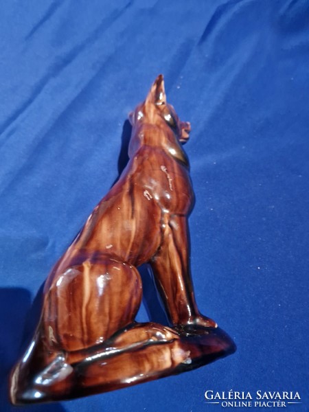 A brown-glazed ceramic figurine of a sitting dog?