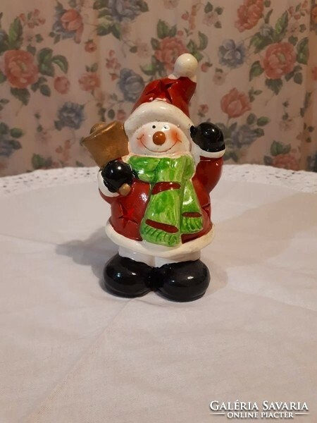 Christmas decoration in several colors, illuminated house, snowman, Santa Claus