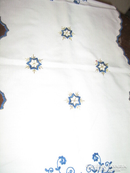 Beautiful hand-embroidered Christmas tablecloth runner with a slinged edge