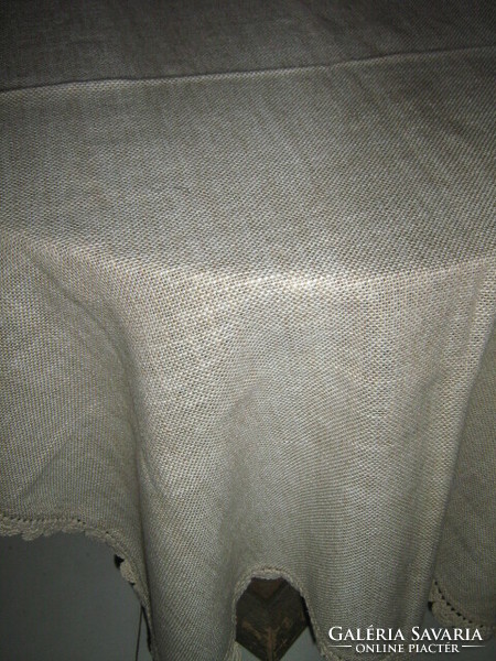 Beautiful beige crochet tablecloth with lacy edges