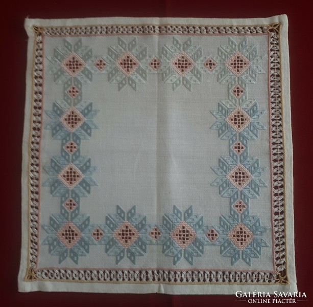 Tablecloth made with the Toledo technique with pale blue and pink shades