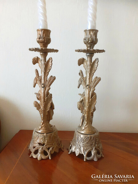 Pair of female and male shaped candle holders. 27 cm