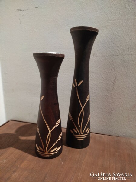A pair of Scandinavian-style solid wood candle holders
