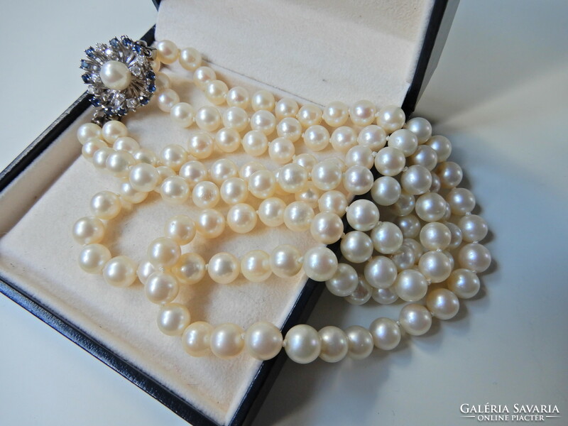 Two rows of genuine Akoya pearls with white gold clasp, sapphire stones and diamonds