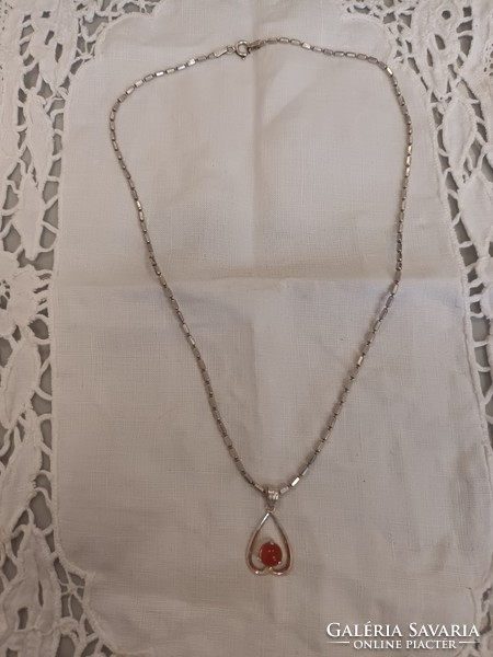 For sale, a lovely old handmade silver chain with a silver carnelian stone pendant!