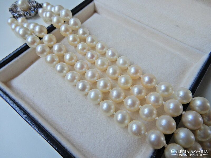 Two rows of genuine Akoya pearls with white gold clasp, sapphire stones and diamonds