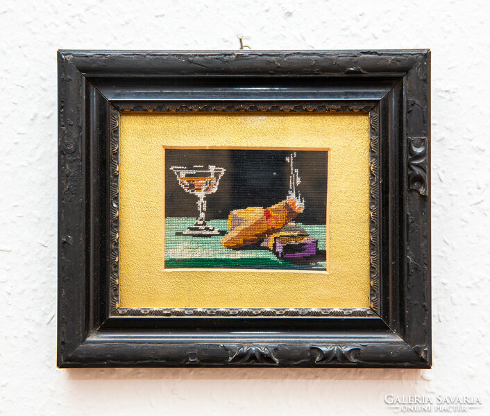 Embroidered wall picture in a decorative frame