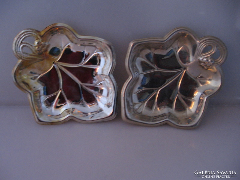 Silver-plated grape leaf-shaped bowl offering nuts, chocolates and candies in a pair