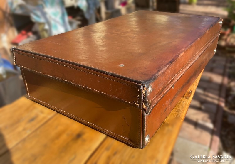 Old brown leather suitcase, retro suitcase - a suitcase from the first half of the last century