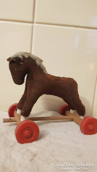 Antique horse figure wheeled toy