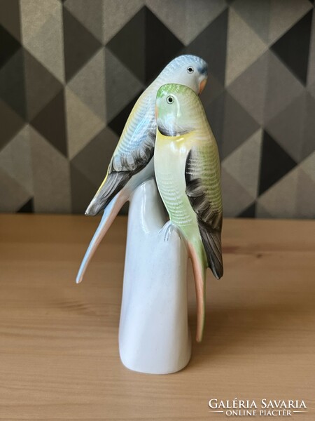 A pair of raven house parrot figures