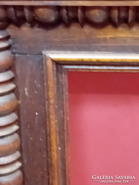A pair of antique hand carved picture frames.