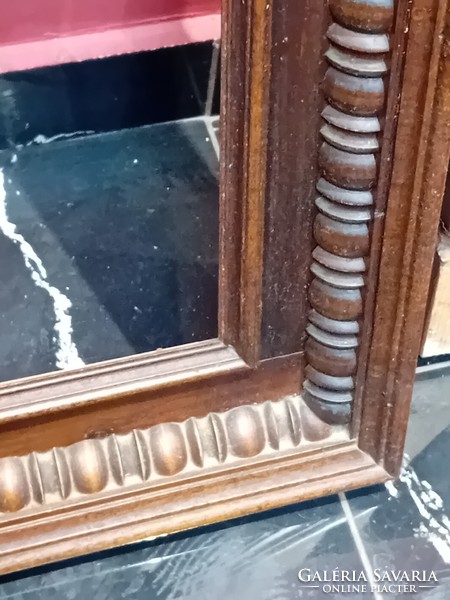A pair of antique hand carved picture frames.